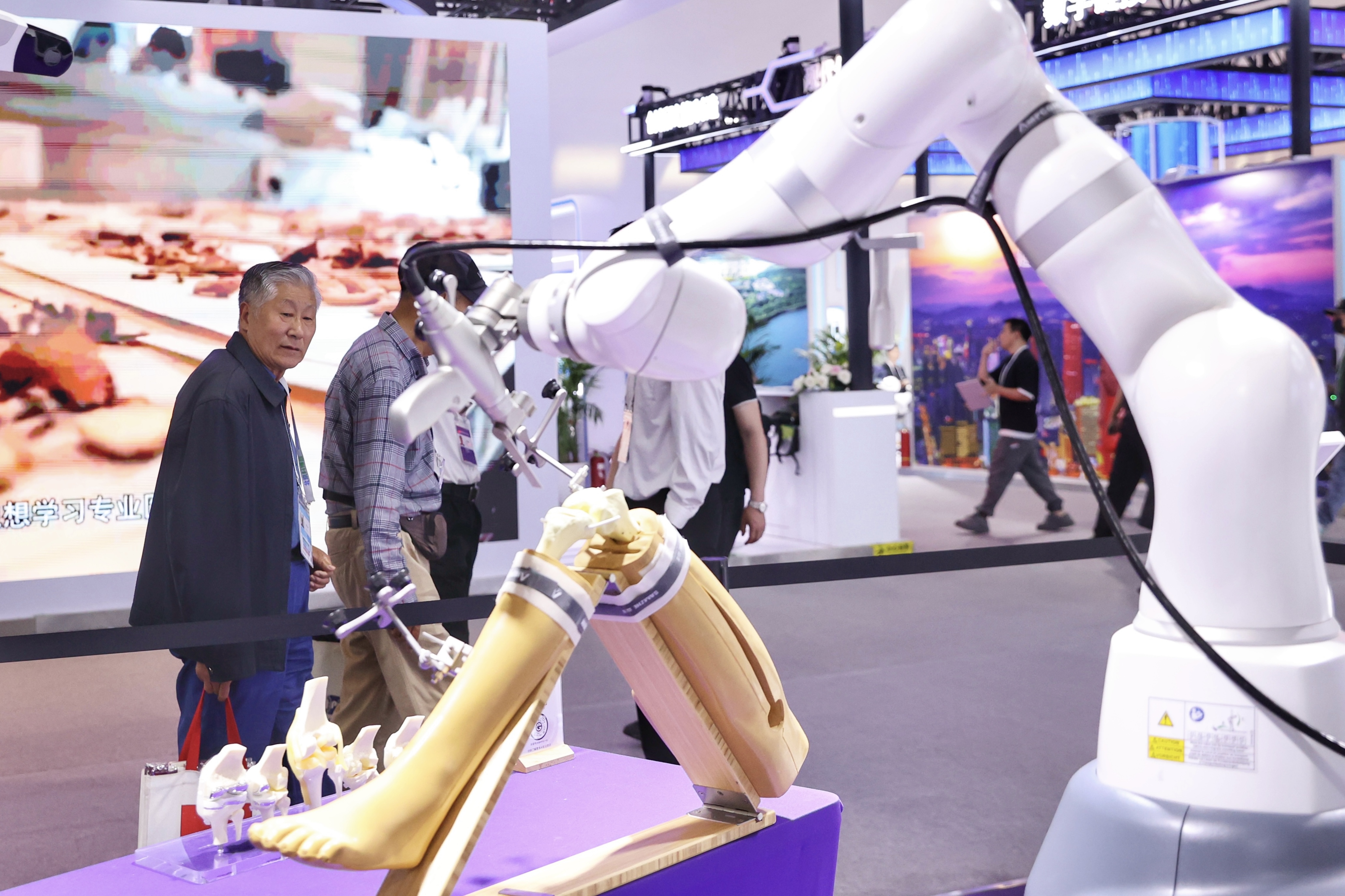 BEIJING, CHINA - MAY 08: An orthopedic surgical robot ROPA demonstrates a knee joint surgery during the 27th China Beijing International High-tech Expo at China National Convention Center on May 8, 2025 in Beijing, China. The 27th China Beijing International High-Tech Expo will be held from May 8 to May 11, 2025 in Beijing. (Photo by Wang Ziru/China News Service/VCG via Getty Images)